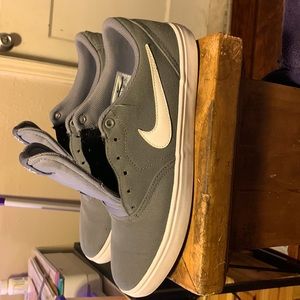 Gently used gray and white Nike SB check for men